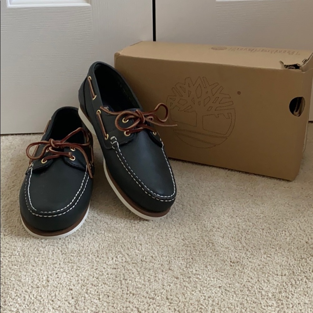 women’s leather slip on shoe by Timberland; navy blue